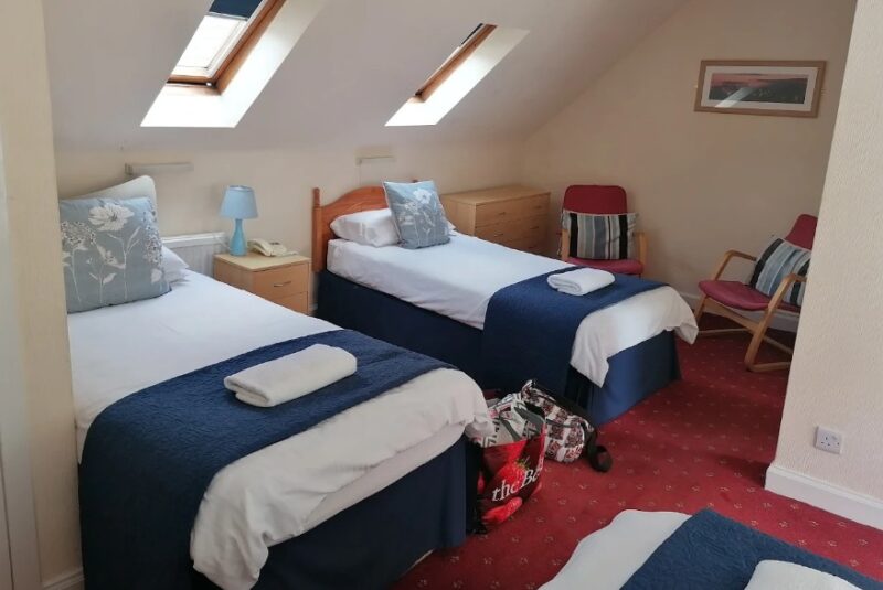 Family room at Green Tree Hotel Peebles with multiple beds
